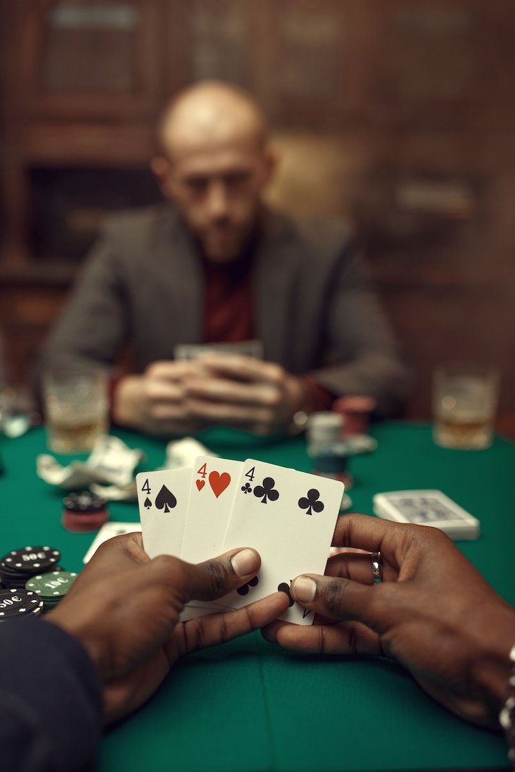 Texas Hold'em Bonus live table interface showing community cards and betting zones